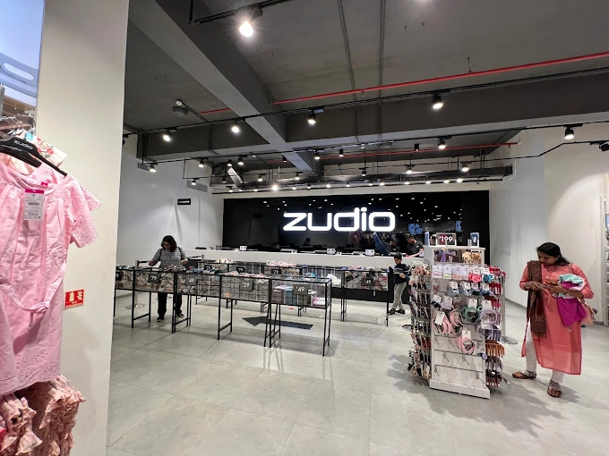 Clothing store interior with customers and display fixtures